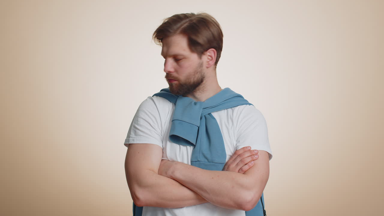 Cheerful funny bully caucasian man showing tongue making silly faces fooling around joking teasing