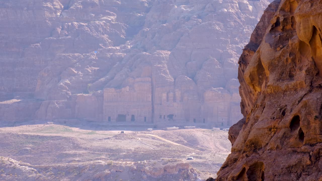 View of temples carved into cliff of mountains in the ancient city of Petra, Jordan
