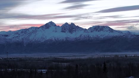 time lapse of clouds over anchorage peaks as the sun sets, alaska