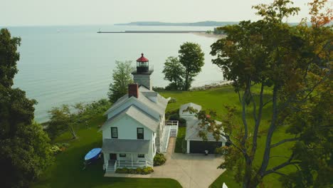 drone shot slow push of the light houses and museum at big sodus point new york vacation spot at the tip of land on the banks of lake ontario