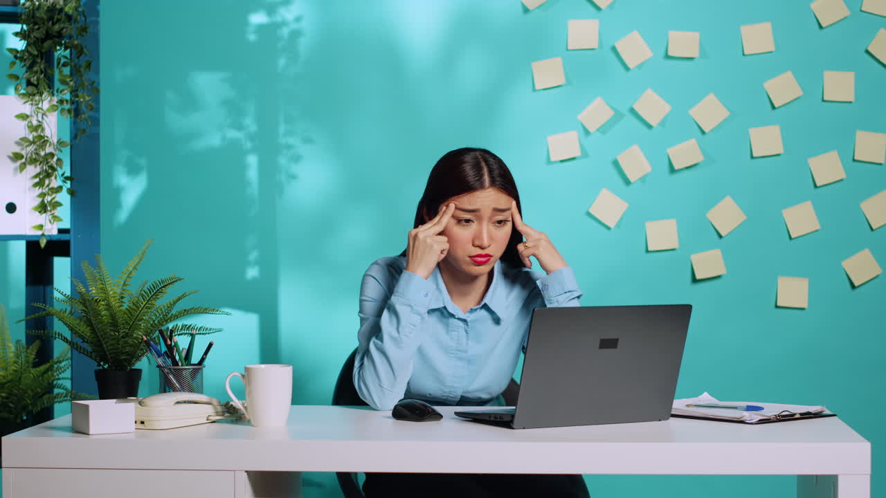 Stressed employee hurting from headache