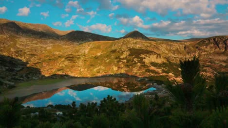 view of a lake in the rila mountains in the morning