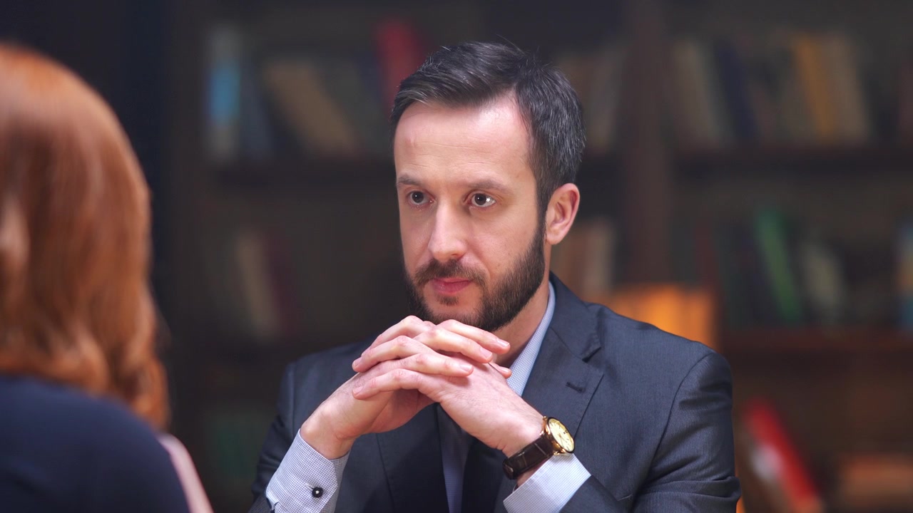 Thoughtful Businessman Listening Attentively During a Meeting