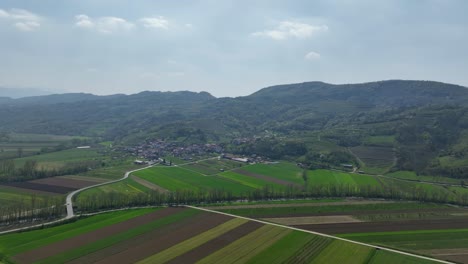 aerial: vipava valley during the day with green pastures in vipava, slovenia, establishing drone shot