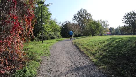 Man-running-and-jogging-outdoor-in-a-park-of-the-city