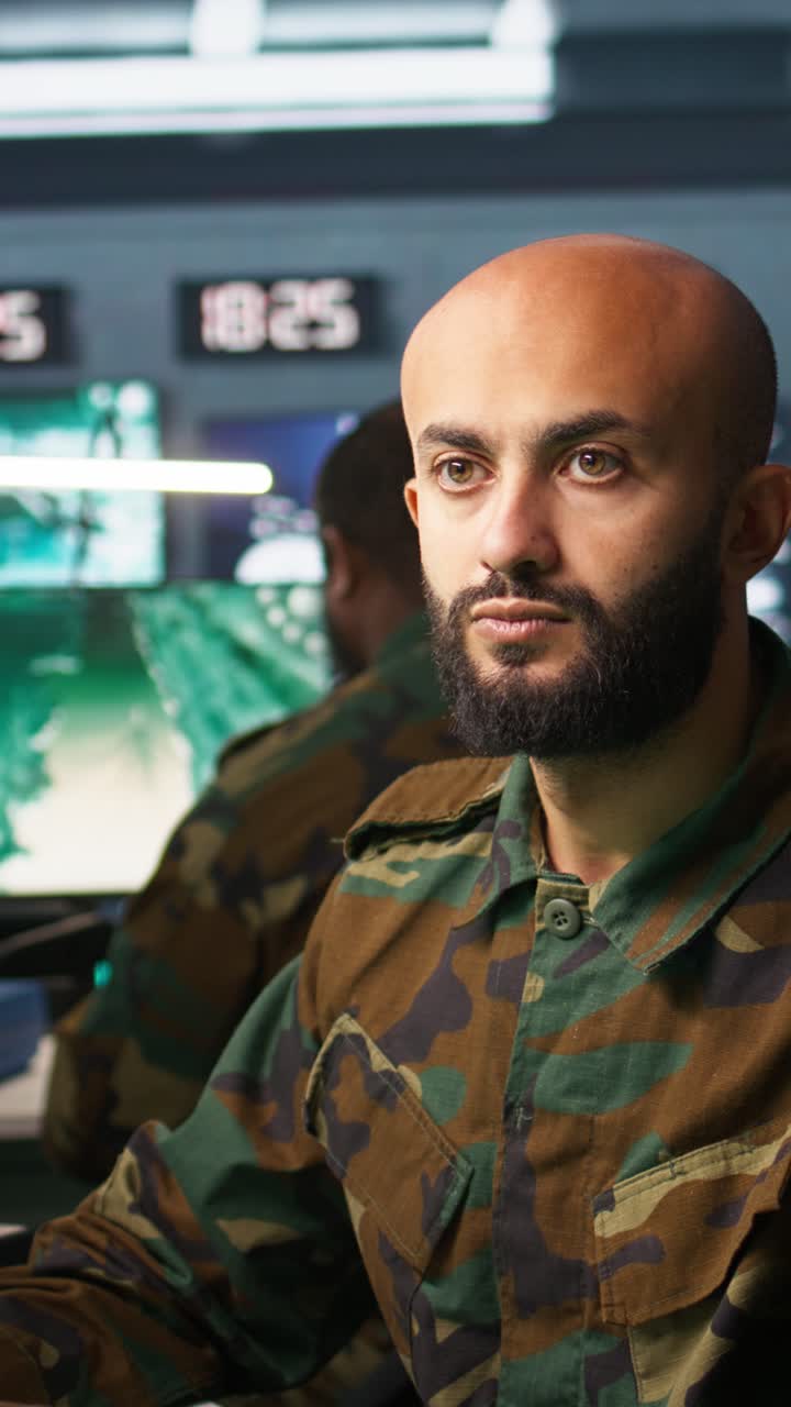 Vertical video Military dispatcher managing communications networks, gathering intel