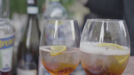 aperol spritz cocktails being served