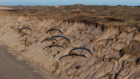 paragliding over sand dunes