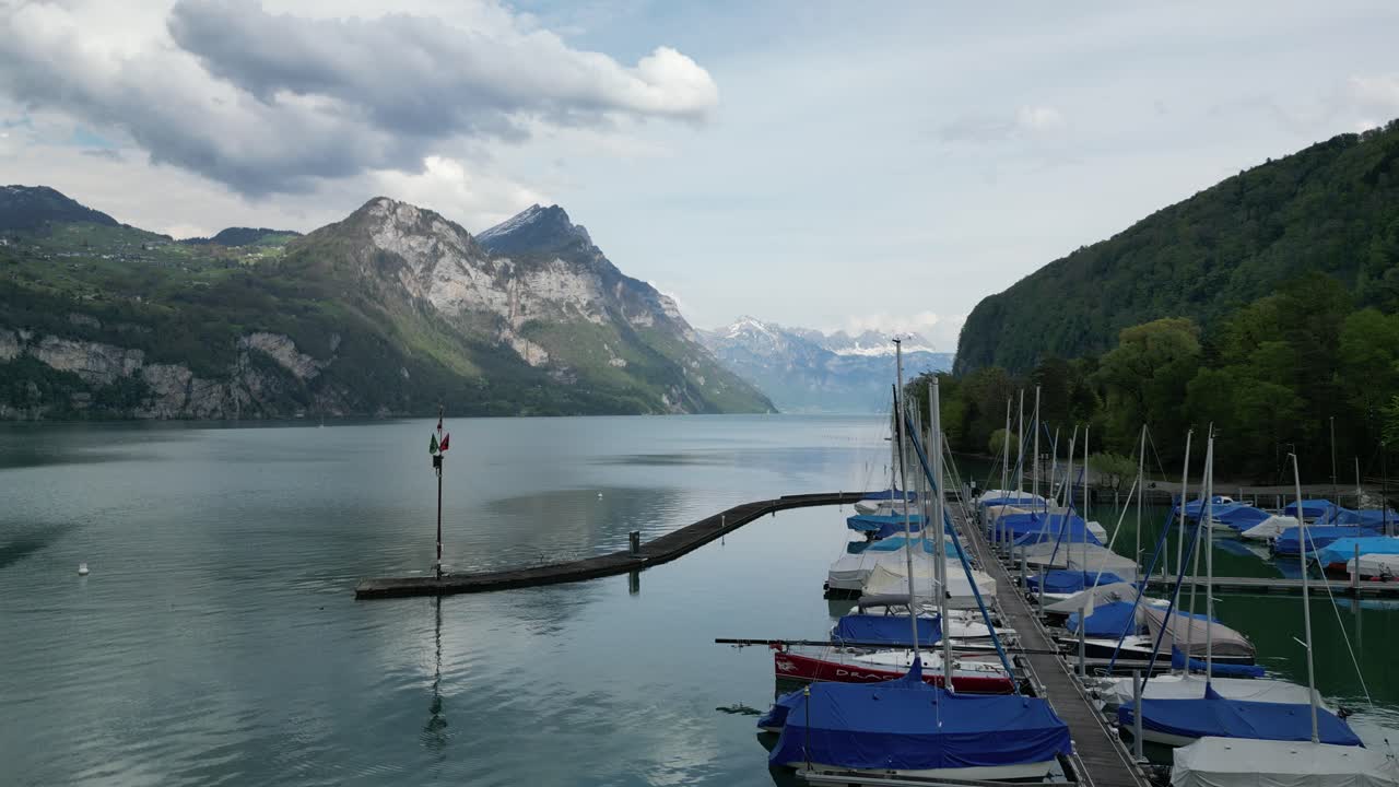 Boats on the lake in G&auml;si Betlis, Walensee Glarus, Weesen Walenstadt, Switzerland- drone view