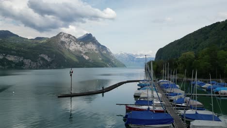 Boats-on-the-lake-in-Gäsi-Betlis,-Walensee-Glarus,-Weesen-Walenstadt,-Switzerland--drone-view