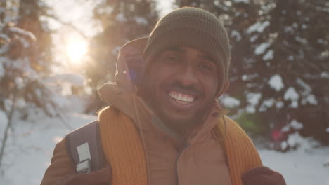 happy man in winter landscape