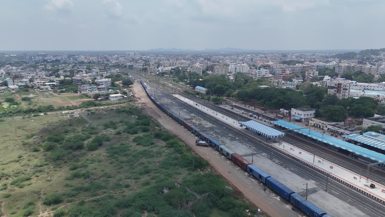 Aerial drone shot of railway track passing through the city in Vijayawada