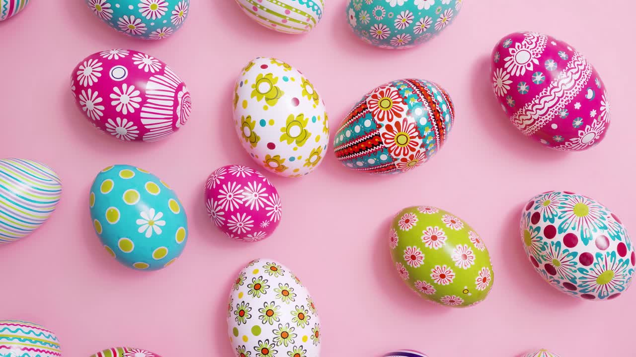 Top-down view of colorful, patterned Easter eggs on a pink background, resembling a festive, playful