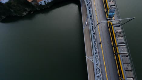 Train-crosses-grey-bridge-FPV-drone-dive-over-Dom-Luis-bridge-Porto-Portugal