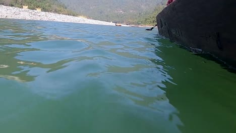 traditional-wood-boat-at-ruining-at-river-at-day