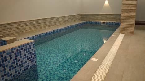 Reveal-Of-Luxury-Indoor-Swimming-Pool-In-Basement-Of-Home