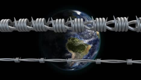 Barbed-wire-against-globe-spinning