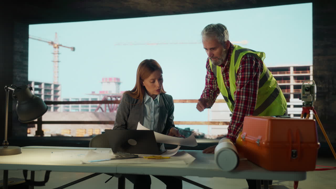 Construction Professionals Collaborating on Site Plans