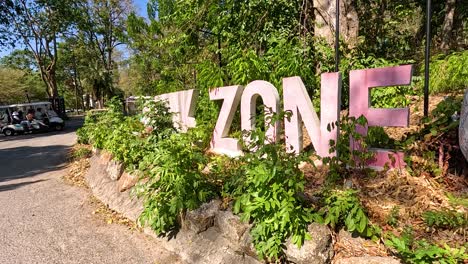 entrance sign and colorful art at the zoo