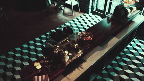 a modern coffee shop interior with an espresso machine and donuts on the counter