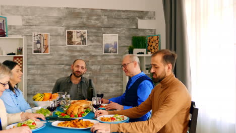 happy and cheerful family enjoying a delicious dinner