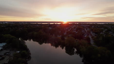 Aerial-view-at-sunset-of-the-nature-and-lakes-of-Roger-Williams-Park-in-Providence,-Rhode-Island