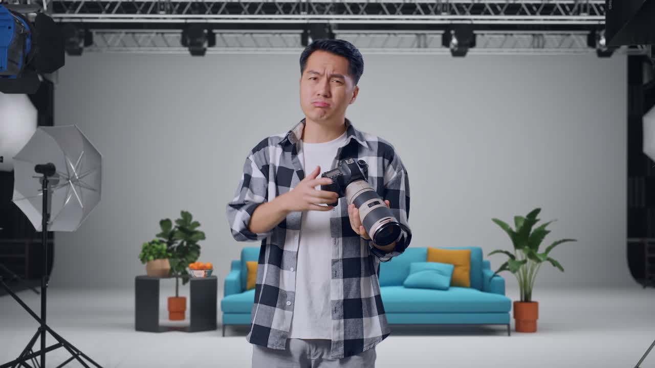 Photographer Frustrated with Camera in Studio