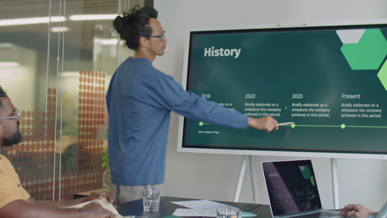 Asian Businessman Giving Presentation on Digital Screen