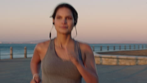 Woman,-beach-running-and-headphones-of-a-runner