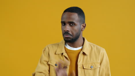man in a yellow denim jacket