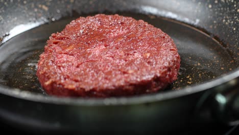 vegan burger cooking in a pan