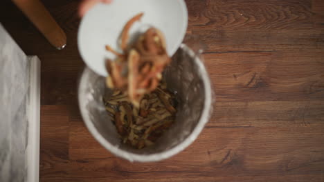 throwing away potato peels