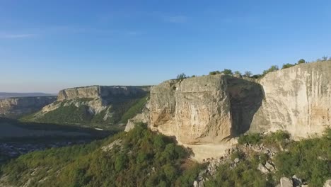 aerial view of dramatic mountain cliffs and valley