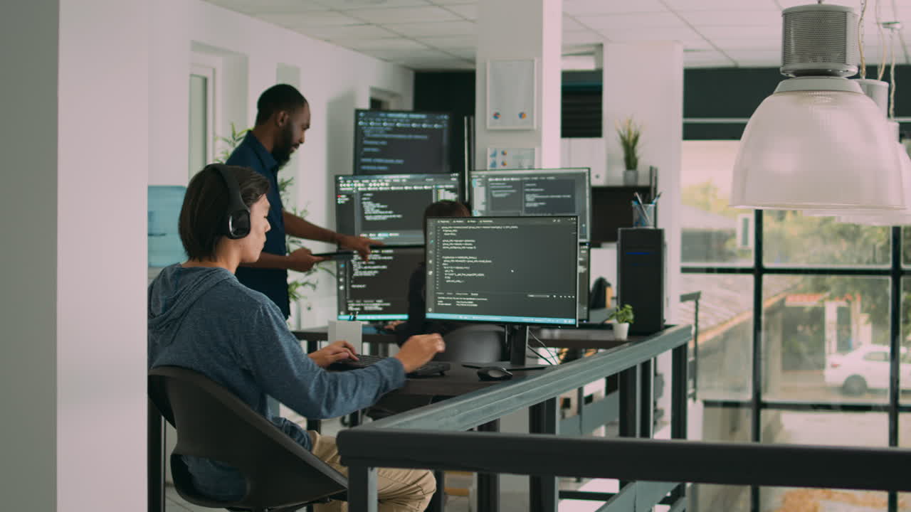 Software developer programming source code algorithm on computer
