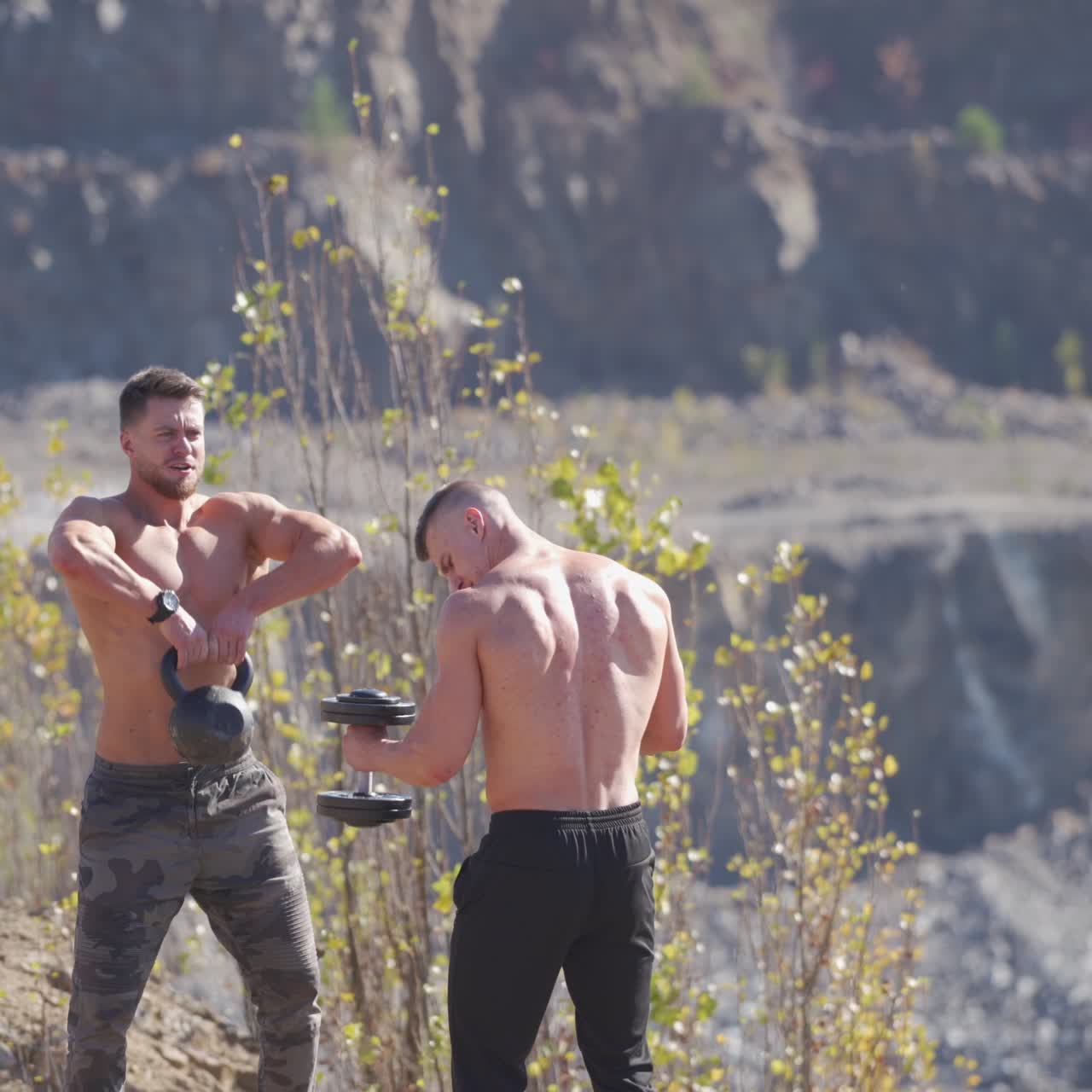 . Man training with dumbbells. Muscular men exercising with dumbbell