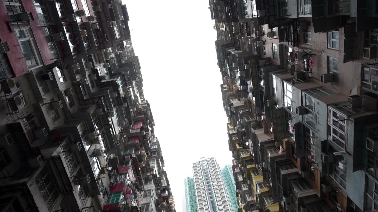 Tilt up view of dense urban living at Yick Cheong Building, Monster Building, Hong Kong