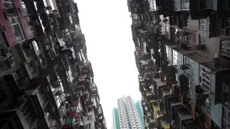 tilt up view of dense urban living at yick cheong building, monster building, hong kong