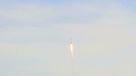 space-faring rocket shooting up on sunny day, close up