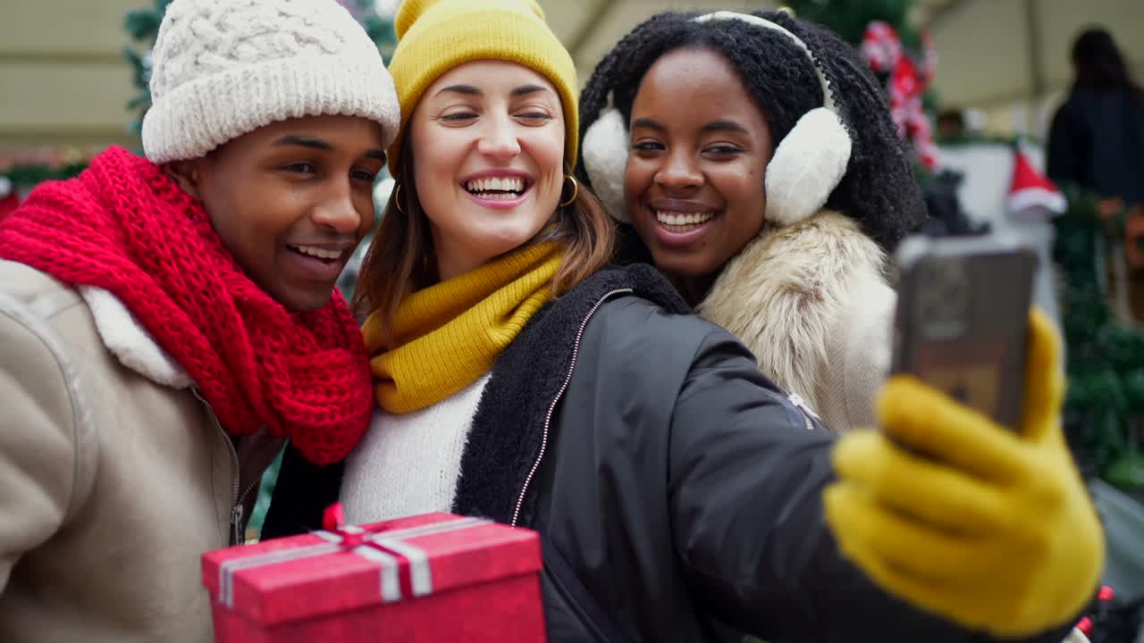 Friends taking a Christmas selfie