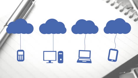 animation of clouds and digital icons over notebook and pen on desk