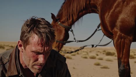 man and horse in the desert