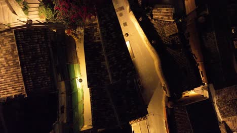 aerial top down view of modica alta val di noto sicily old baroque town rooftops southern italy at night