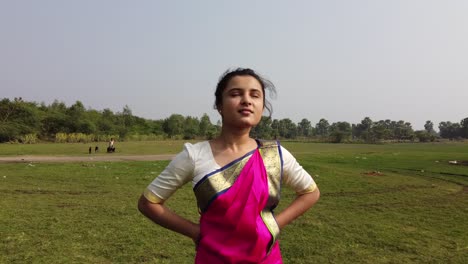 A-bharatnatyam-dancer-displaying-a-classical-bharatnatyam-pose-in-the-nature-of-Vadatalav-lake,-Pavagadh