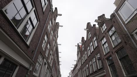 traditional dutch architectural buildings in amsterdam, residential street in downtown area