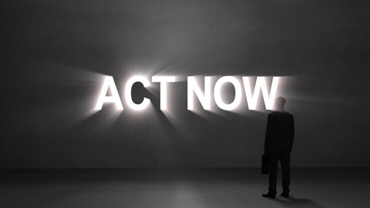 Businessman looking at giant act now text