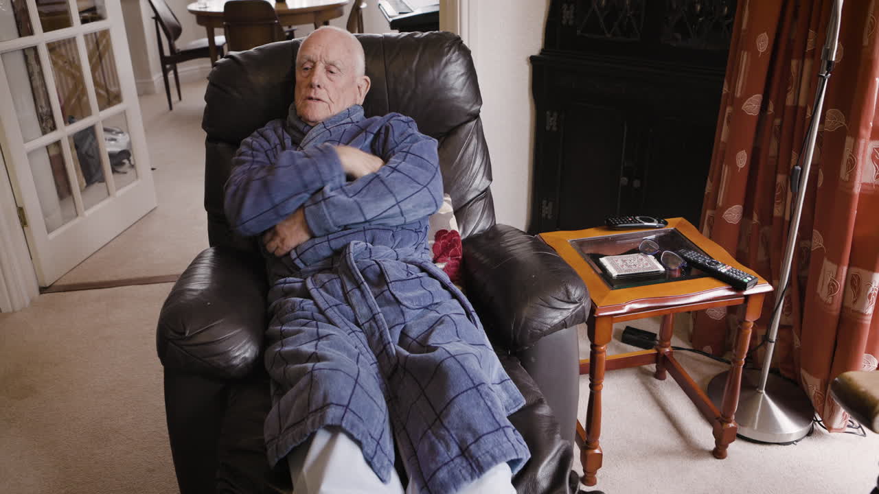 Elderly man resting in a recliner