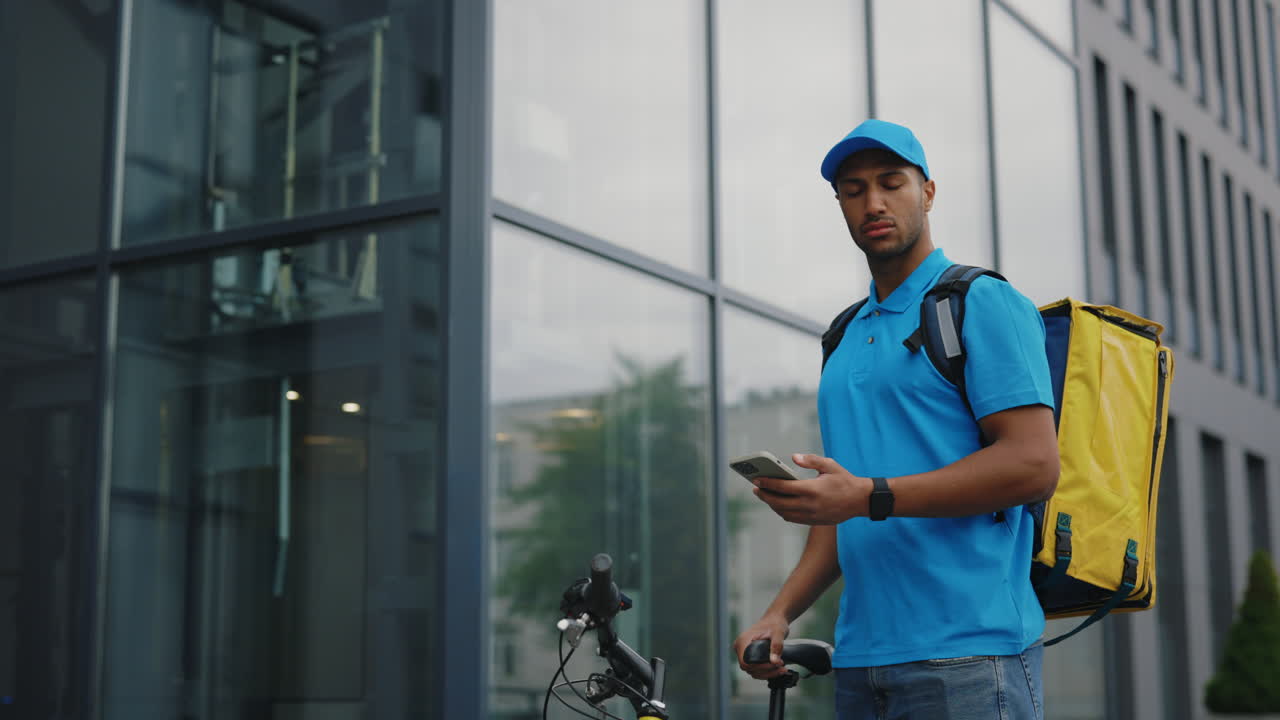 Food Delivery Person Using Smartphone
