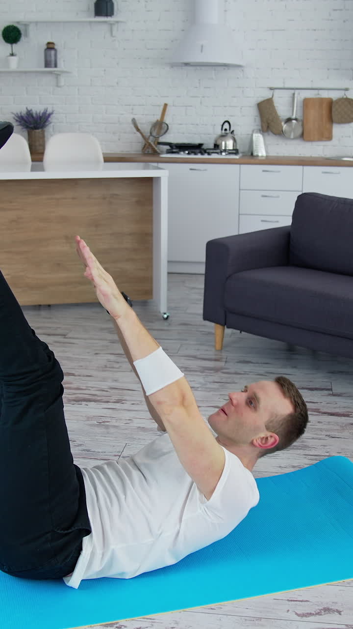 Handsome man training indoor. Lifestyle athlete body man working out in home