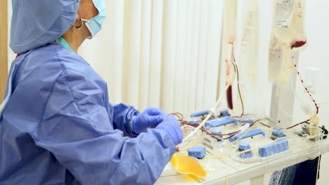 nurse installing hemodialysis machine in the hospital