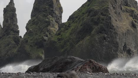 majestic wave splashing against black beach volcanic rock in iceland